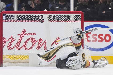 Vegas Golden Knights goalie Jonathan Quick gives up a goal to Vancouver Canucks' J.T. Miller on ...