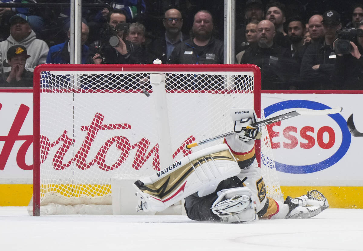 Vegas Golden Knights goalie Jonathan Quick gives up a goal to Vancouver Canucks' J.T. Miller on ...
