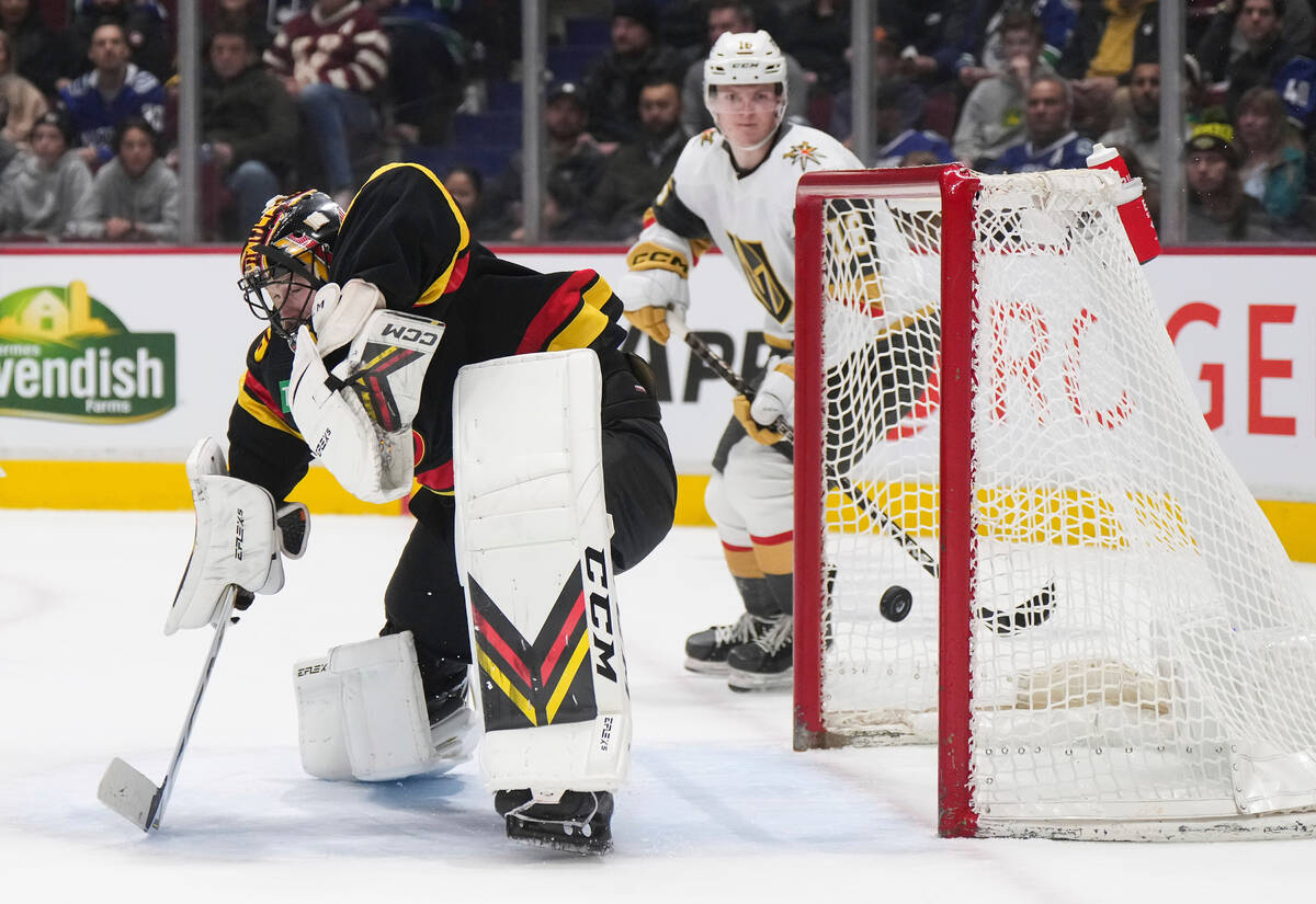 Vancouver Canucks goalie Thatcher Demko gives up a goal to Vegas Golden Knights' Reilly Smith, ...