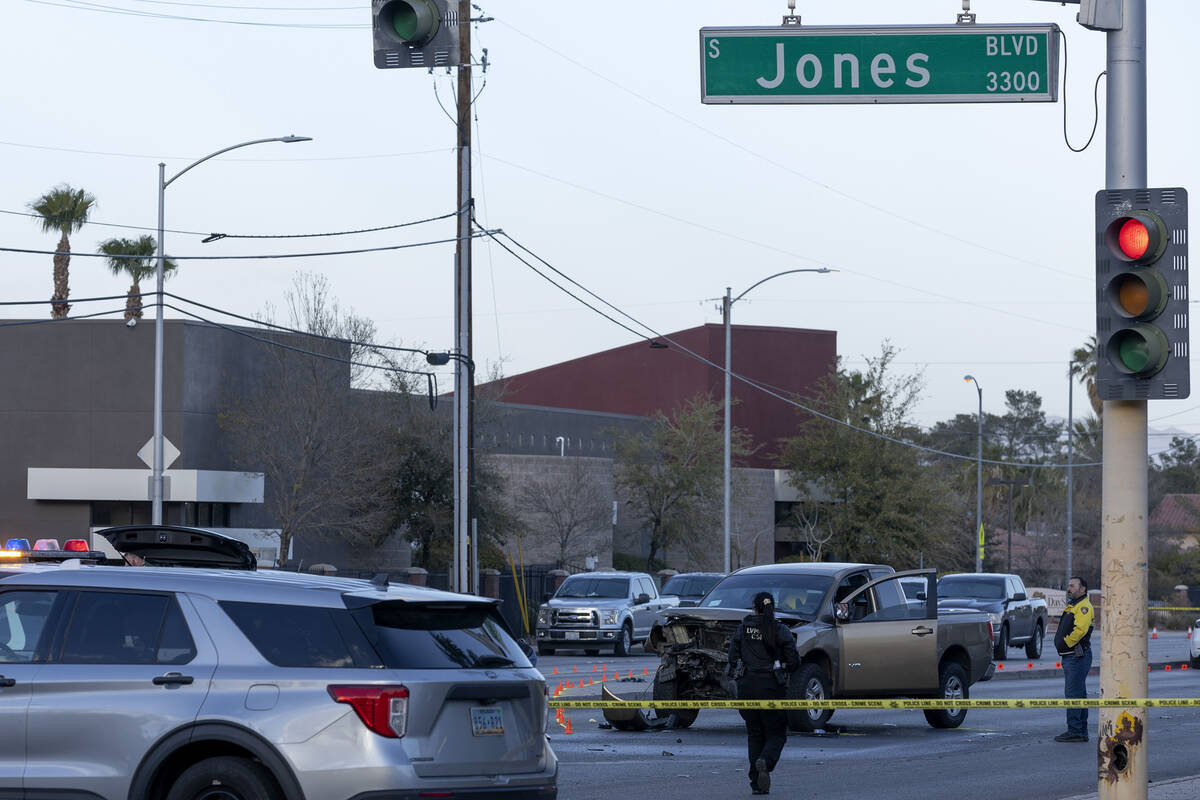 Metropolitan police respond to the scene of a fatal car crash at the intersection of West Deser ...
