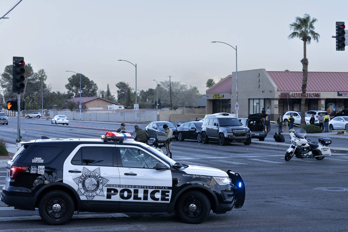 Metropolitan police respond to the scene of a fatal car crash at the intersection of West Deser ...