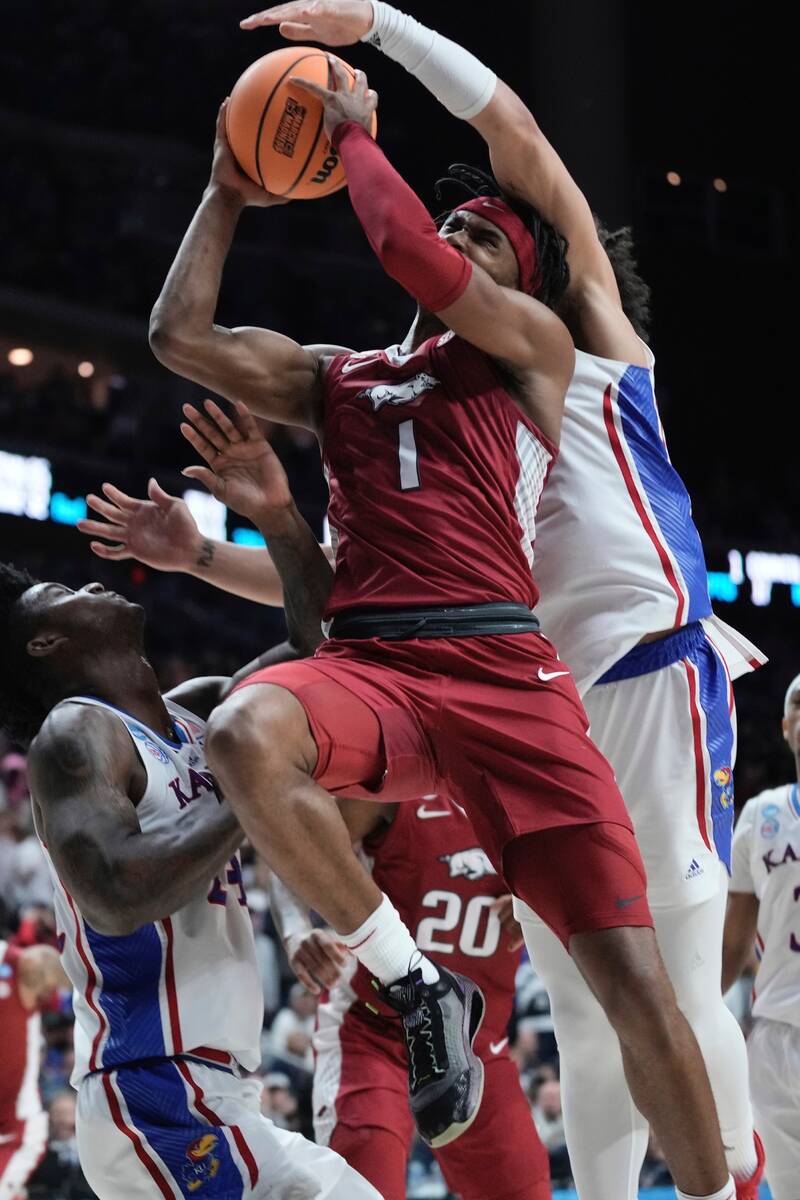 Arkansas' Ricky Council IV is fouled by Kansas' Jalen Wilson during the second half of a second ...