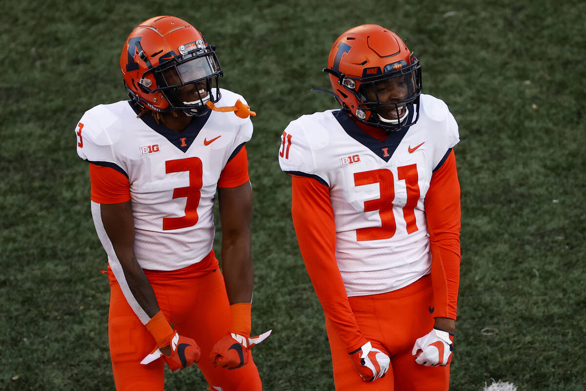 Illinois defensive back Devon Witherspoon (31) reacts after making an interception with Illinoi ...