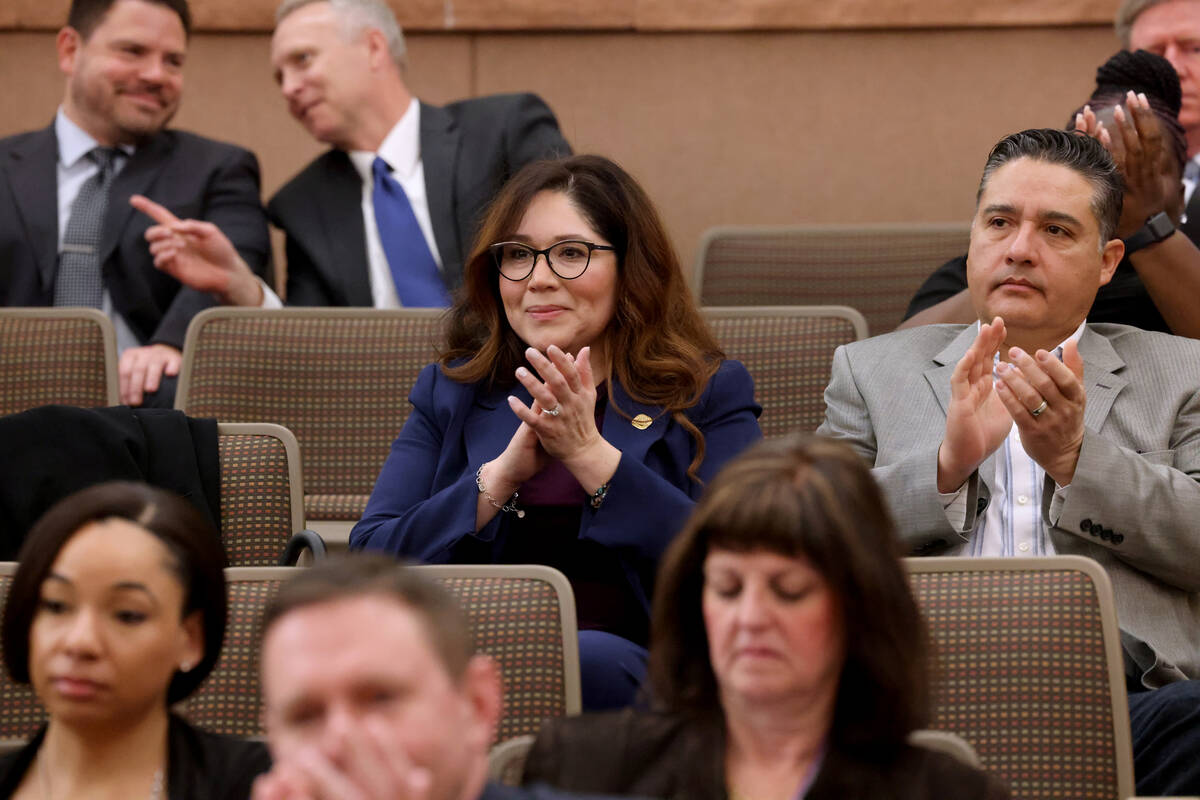 Assistant Clark County Registrar of Voters Lorena Portillo, center, attends a Commission meetin ...
