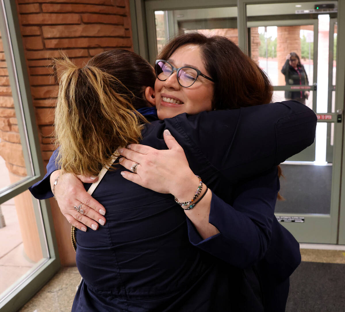 Clark County Registrar of Voters Lorena Portillo, right, hugs her sister Rocio Portillo at the ...