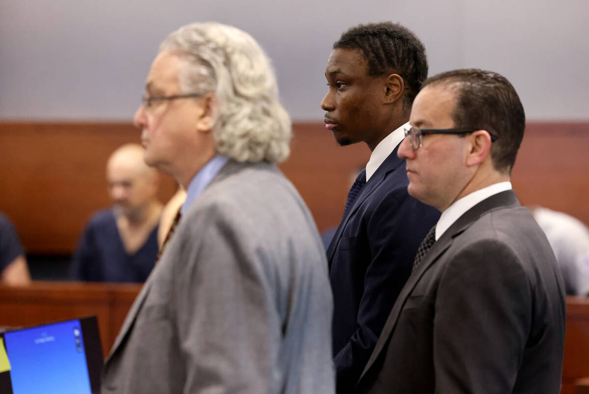 Former Raiders player Henry Ruggs, center, appears in court with his attorneys David Chesnoff, ...