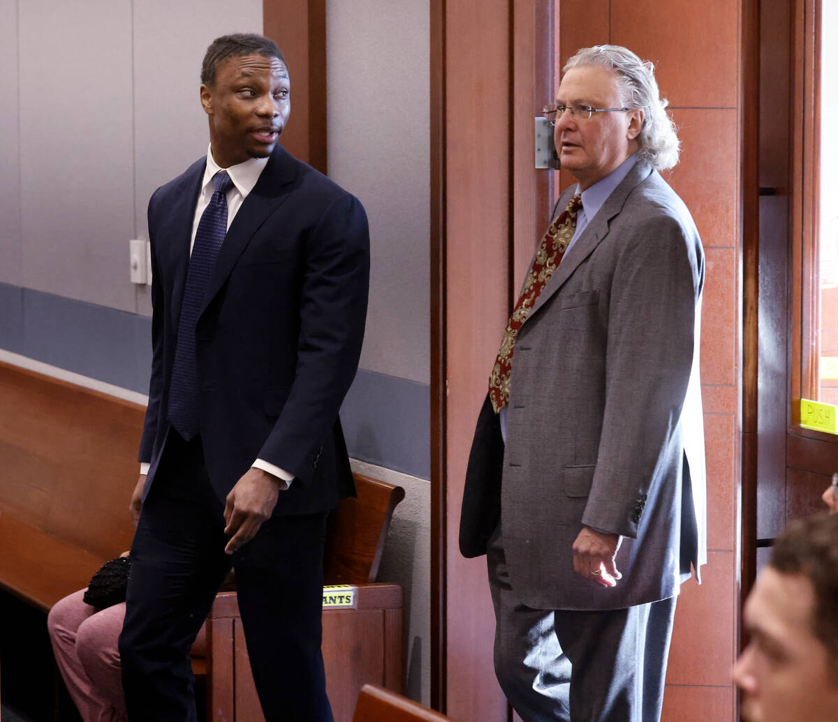 Former Raiders player Henry Ruggs, left, arrives in court with his one of his attorneys, David ...
