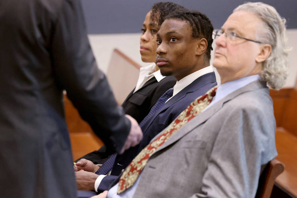 Former Raiders player Henry Ruggs, center, waits in court with his one of his attorneys, David ...