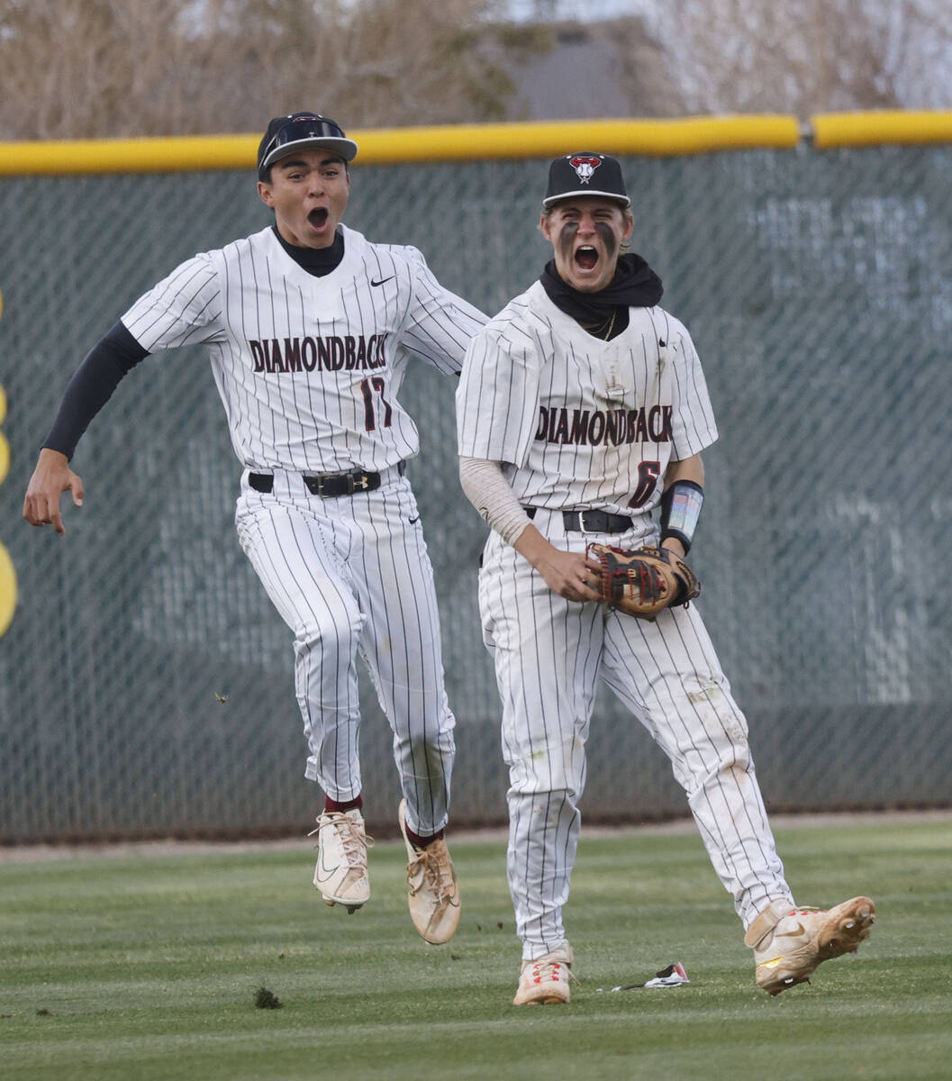 Desert Oasis' Noah Griffith (17) and his teammate Ryan Martin (6) celebrate their 2-1 victory a ...