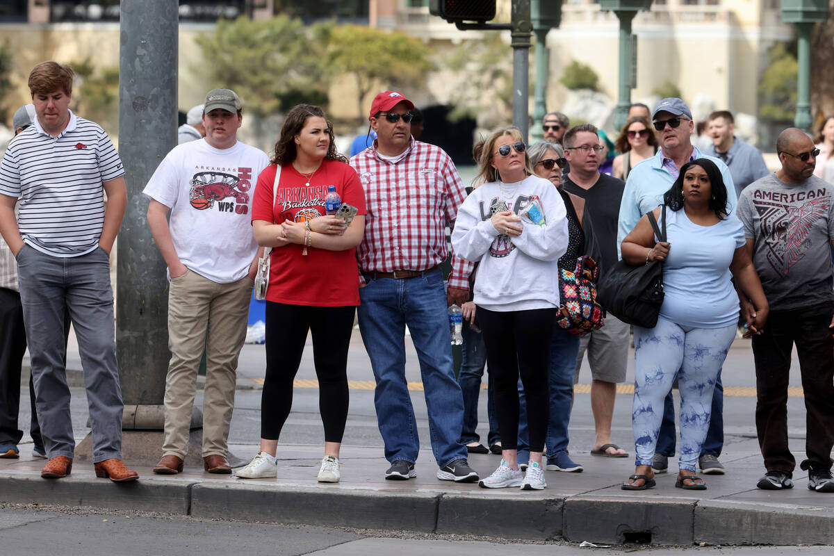 People walk on the Strip at the Bellagio in Las Vegas Thursday, March 23, 2023. The Las Vegas C ...