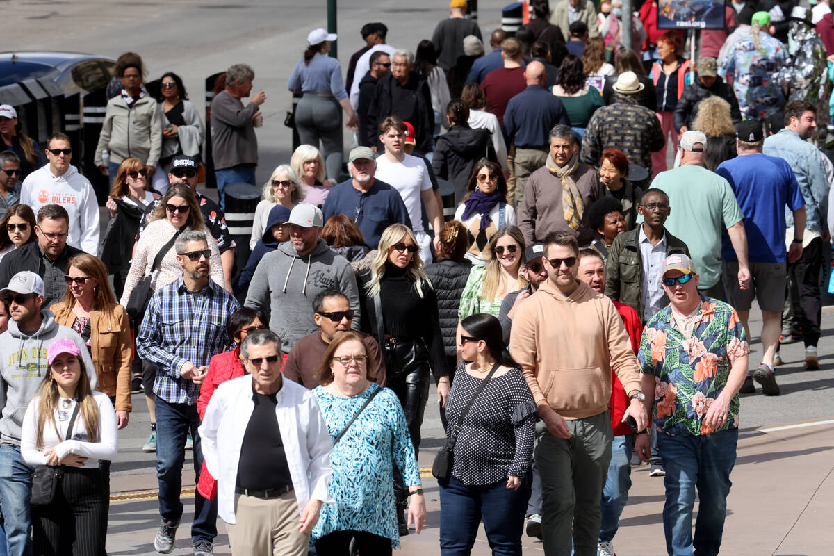 People walk on the Strip at Planet Hollywood Resort in Las Vegas Thursday, March 23, 2023. The ...