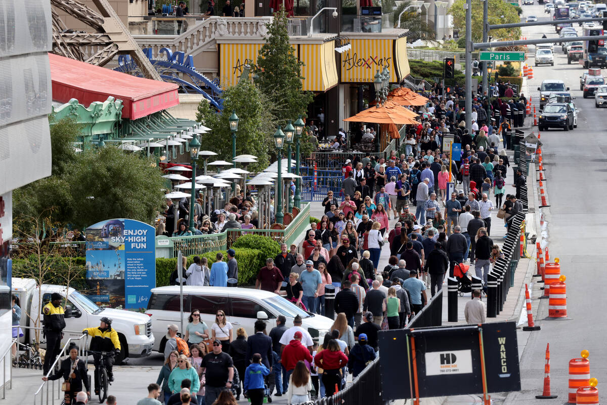 People walk on the Strip at Paris Las Vegas Thursday, March 23, 2023. The Las Vegas Convention ...