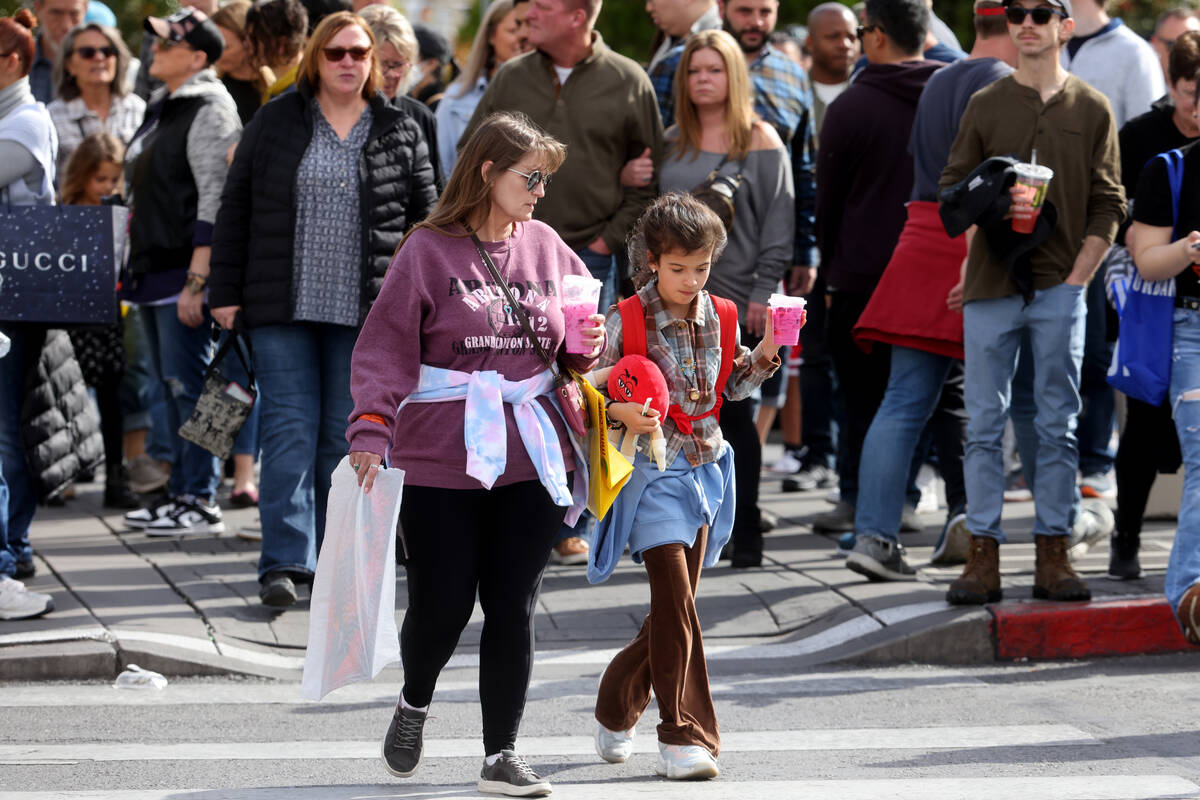 People walk on the Strip at Caesars Palace in Las Vegas Thursday, March 23, 2023. The Las Vegas ...
