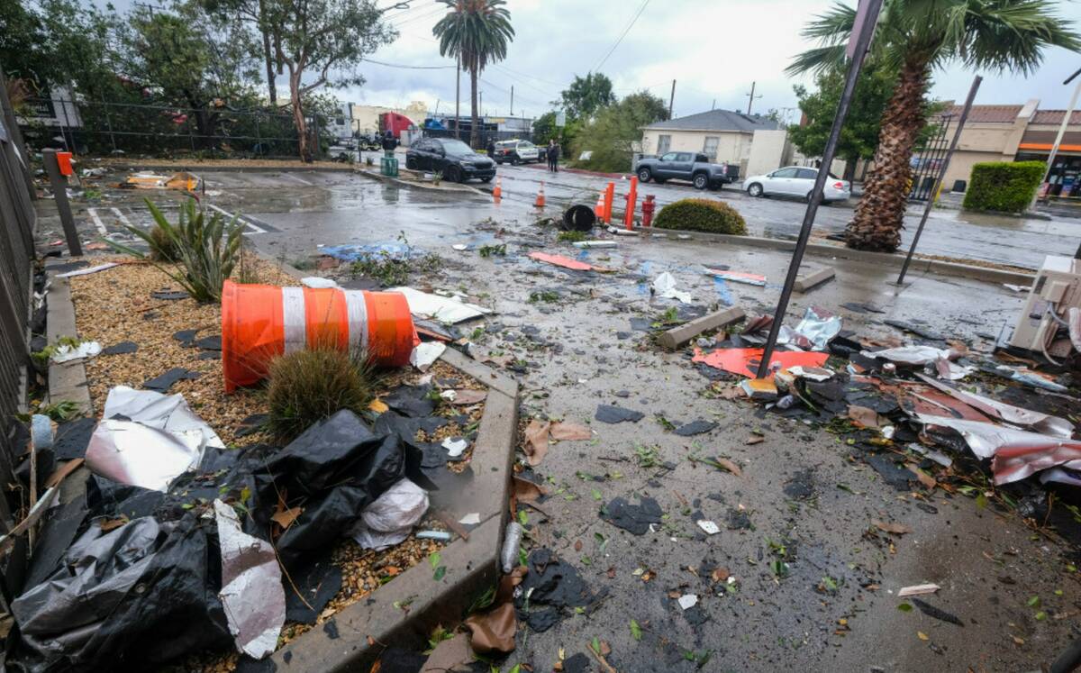 Debris is seen after a strong microburst damaged several buildings Wednesday, March 22, 2023 in ...