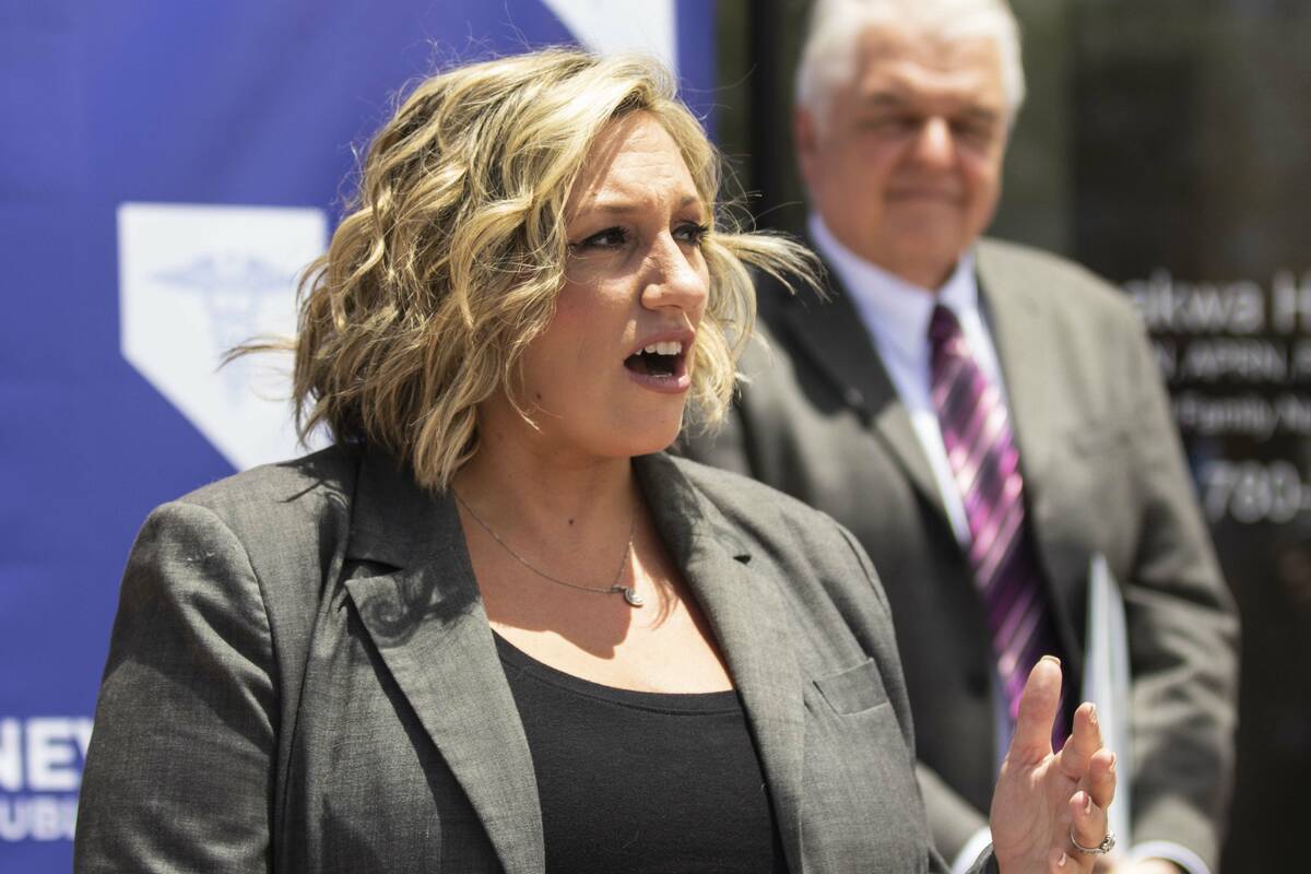FILE - State Majority Leader Nicole Cannizzaro speaks as Gov. Steve Sisolak looks on, on Wednes ...