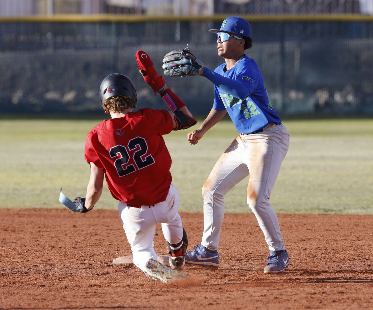 Las Vegas' Bryden Bull (22) steals second base as Green Valley's Caden Kirby (12) waits for a b ...