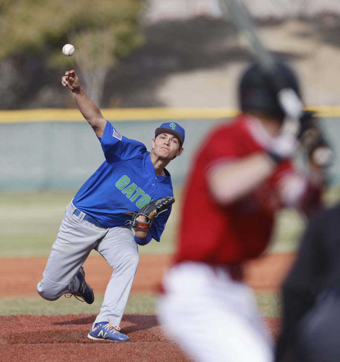 Green Valley's Bridger Knudson (8) delivers to Las Vegas' Gage McGown (13) during the second in ...