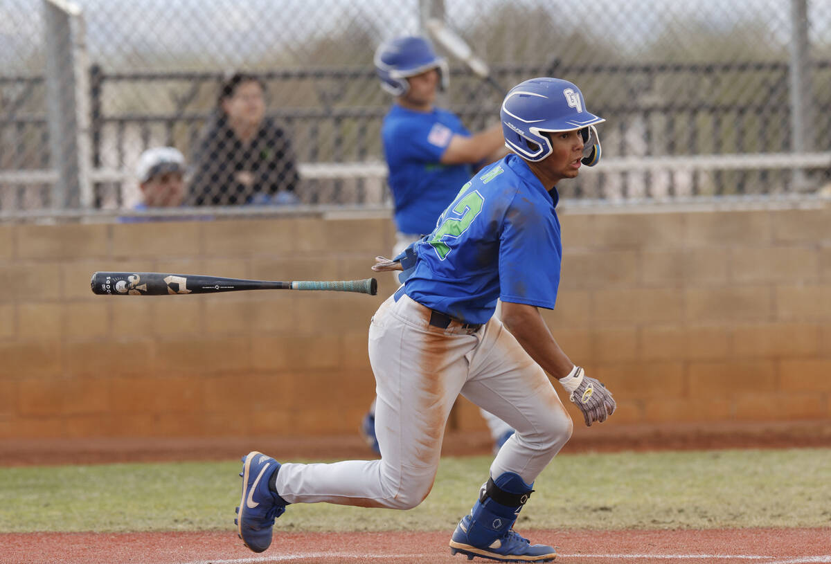 Green Valley's Caden Kirby (12) hits an RBI single during the second inning of a baseball game, ...