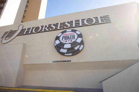 Signage for the World Series of Poker is pictured next to a sign for the Horseshoe, formerly Ba ...