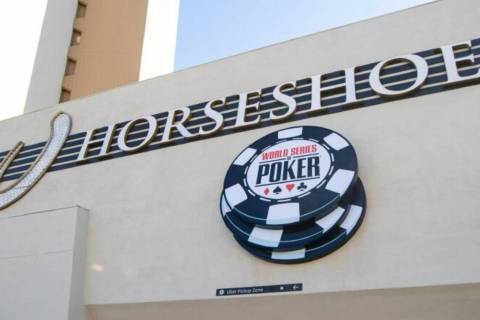 Signage for the World Series of Poker is pictured next to a sign for the Horseshoe, formerly Ba ...