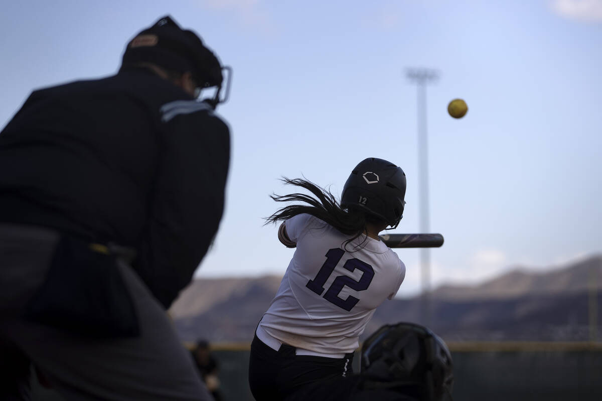 Silverado’s Ava Monturio (12) hits a line drive during a high school softball game again ...