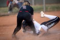 Desert Oasis’ Cassidy Infante (2) tags out Silverado’s LeAnna Cortez at home plate during a ...