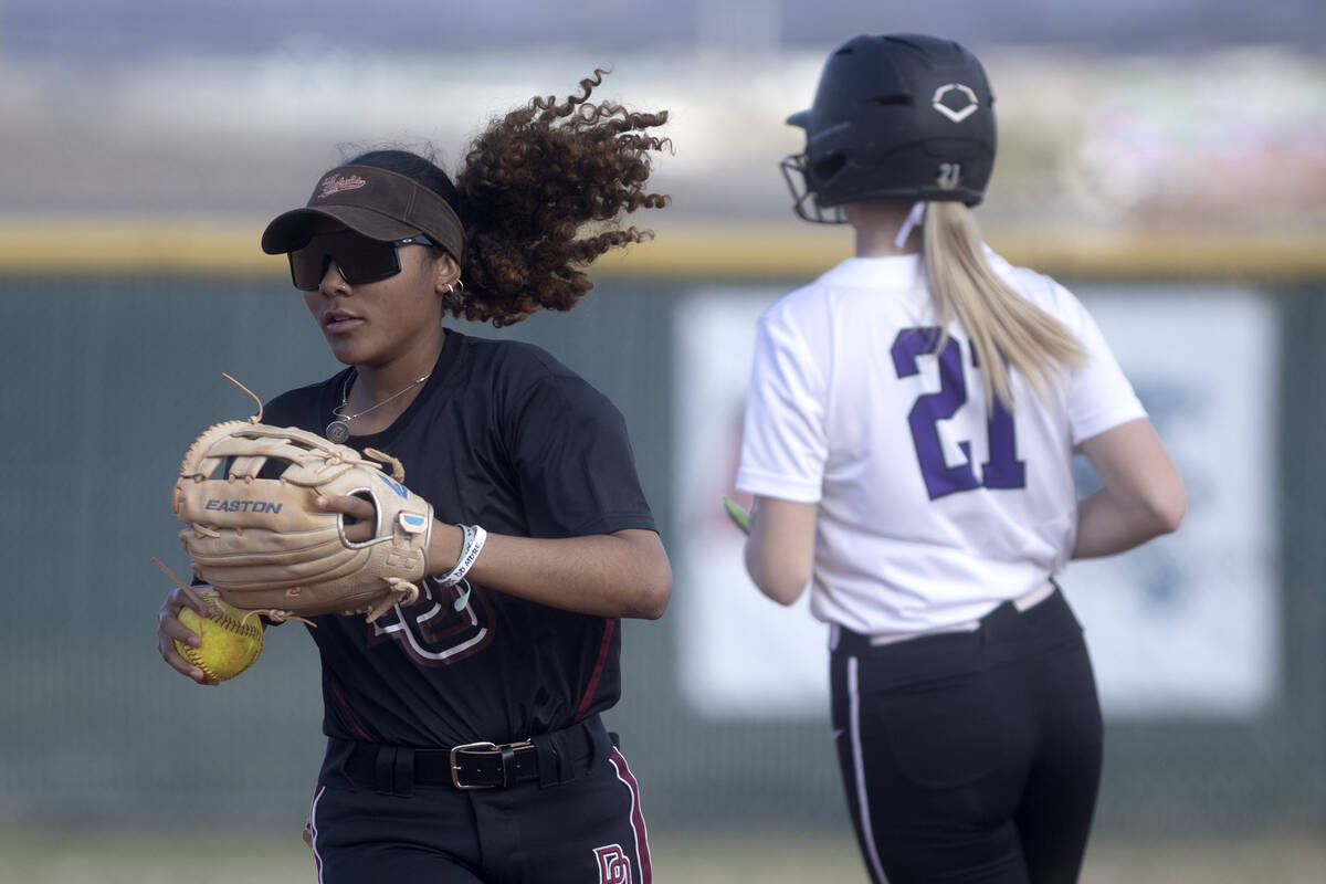 Desert Oasis’ Taylor Adams runs in after ending the inning with a caught ball for an out ...