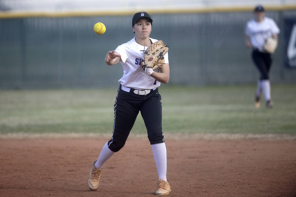 Silverado’s Yvonne Jimenez throws to first base during a high school softball game again ...