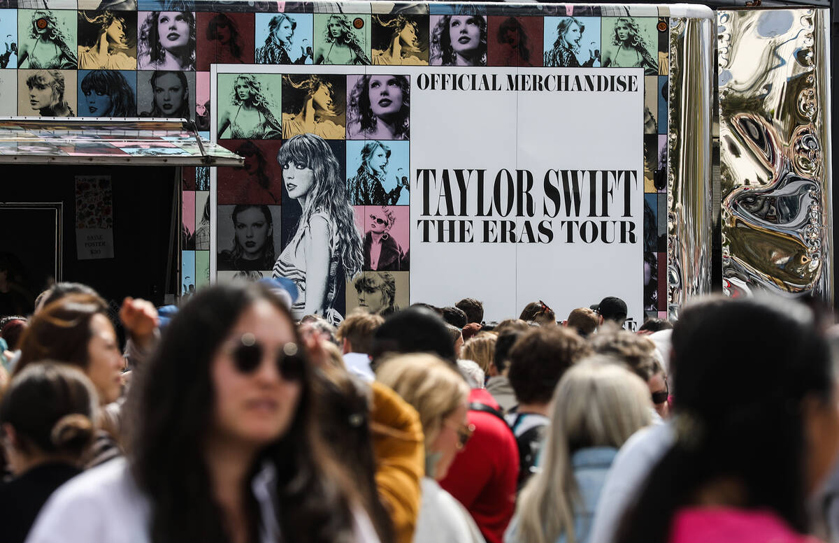 Fans wait in line for Taylor Swift merchandise at a pop-up store outside Allegiant Stadium in L ...