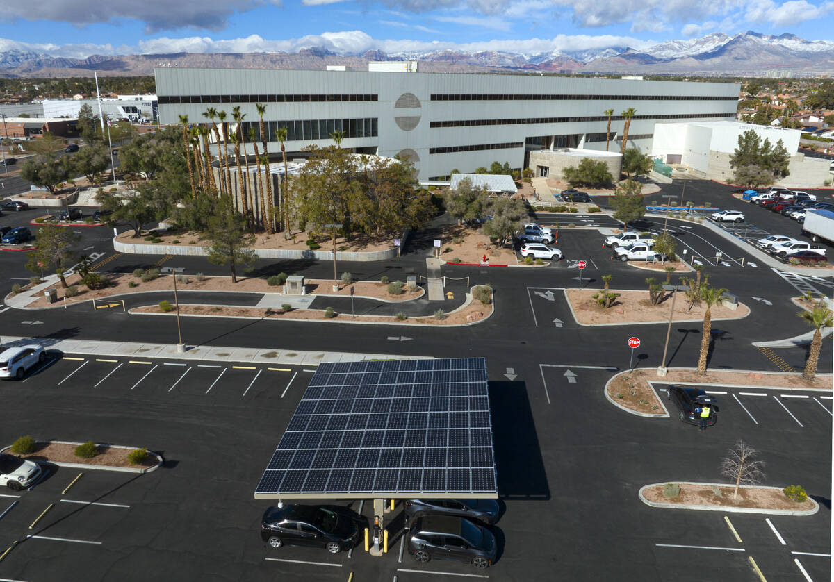 NV Energy's headquarters is seen as electric vehicles get their battery recharged in its parkin ...