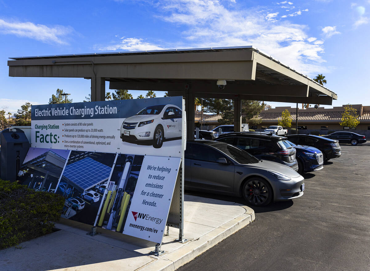 Electric vehicles get their battery recharged in the parking lot of NV Energy's headquarters at ...