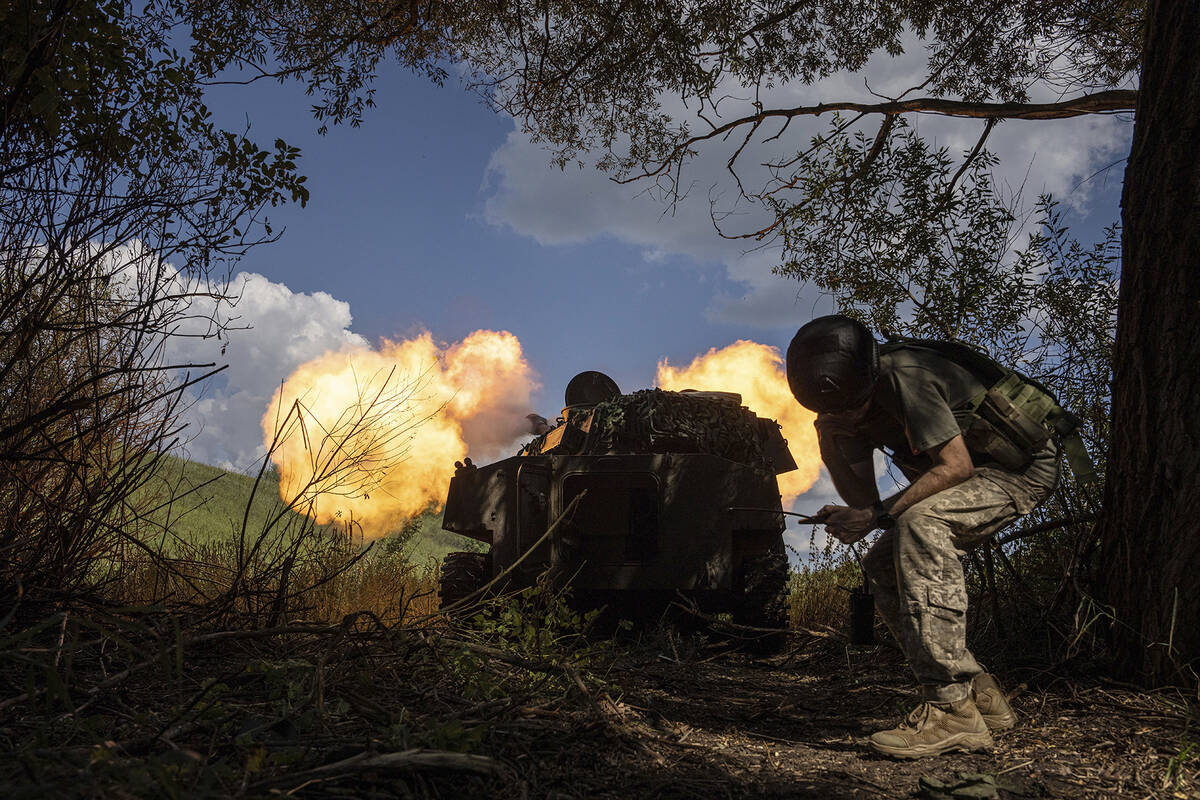 Ukrainian self-propelled artillery shoots toward Russian forces at a frontline in Kharkiv regio ...
