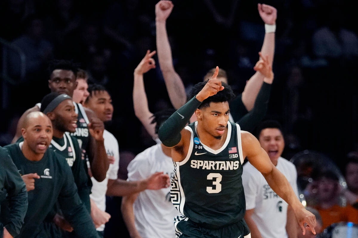 Michigan State guard Jaden Akins (3) reacts after a three-point basket in the second half of a ...