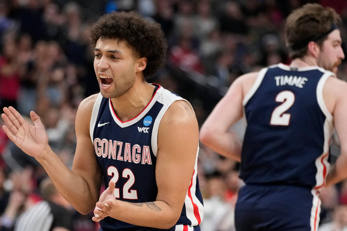 Gonzaga's Anton Watson (22) celebrates after making a three-point basket in the first half of a ...