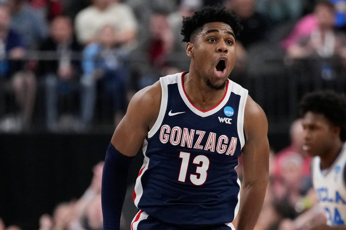 Gonzaga's Malachi Smith (13) celebrates in the second half of a Sweet 16 college basketball gam ...