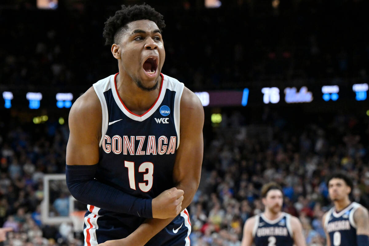 Gonzaga's Malachi Smith (13) celebrates in the second half of a Sweet 16 college basketball gam ...