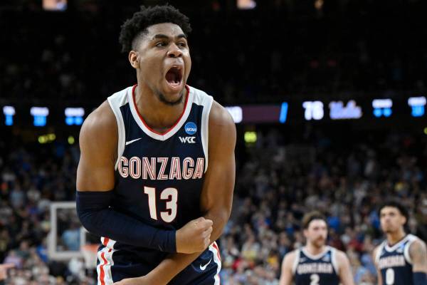 Gonzaga's Malachi Smith (13) celebrates in the second half of a Sweet 16 college basketball gam ...