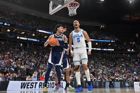 UCLA's Amari Bailey (5) celebrates next to Gonzaga's Julian Strawther in the first half of a Sw ...
