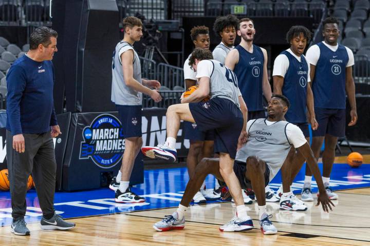 UConn players conducts a charging drill during the West Regional practice for the Sweet 16 game ...
