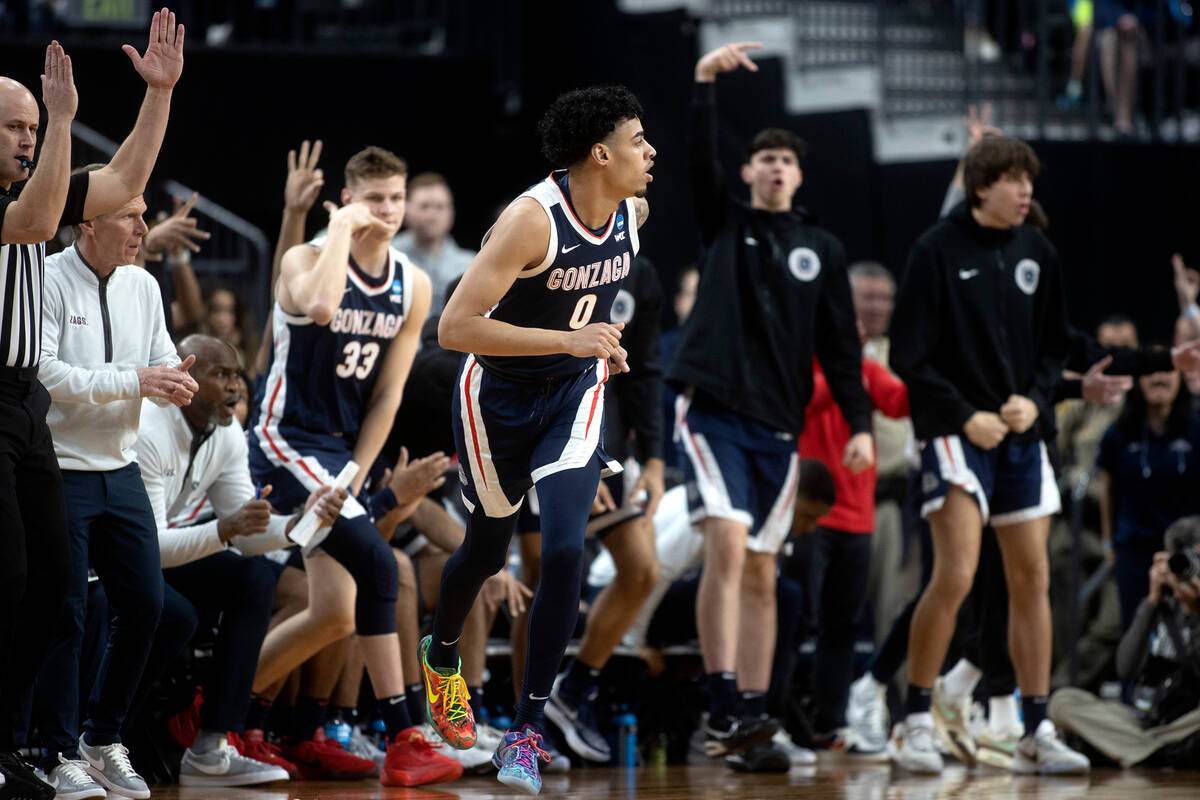 Gonzaga Bulldogs guard Julian Strawther (0) watches the ball after making a three-pointer while ...