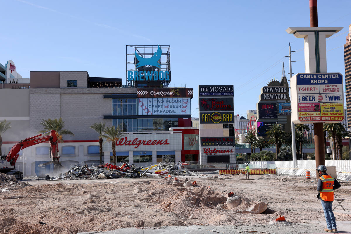 Crews clear the remains of buildings at 3755 Las Vegas Blvd. South on the Strip in Las Vegas Mo ...
