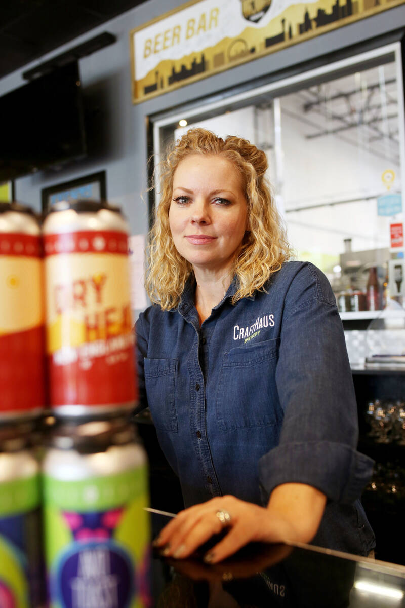 Owner of CraftHaus Brewery Wyndee Forrest displays their in house craft beer in cans which has ...