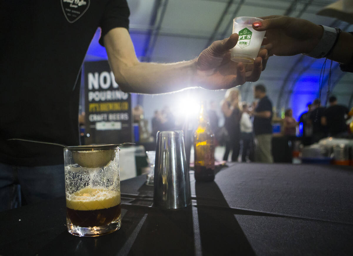 Bartender Keith Baker prepares to pour the Vampyre Killer, made with AleSmith My Bloody Valenti ...
