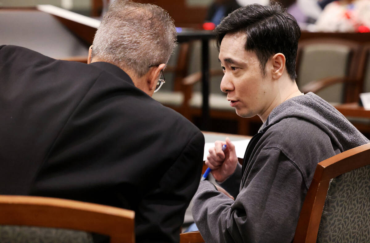 Chan Park, right, talks to his standby attorney Ozzie Fumo while he represents himself in court ...