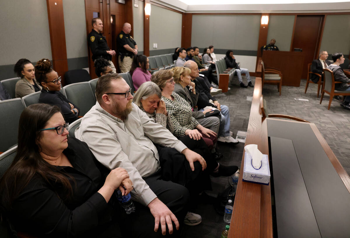 Jamie Burman, daughter of murder victim Kevin Hackett, left, listens to closing arguments in th ...