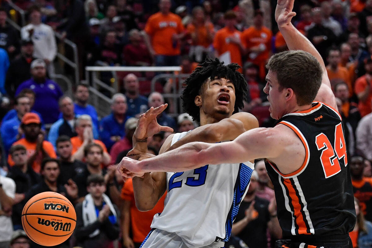 Creighton guard Trey Alexander (23) collides with Princeton guard Blake Peters (24) in the firs ...
