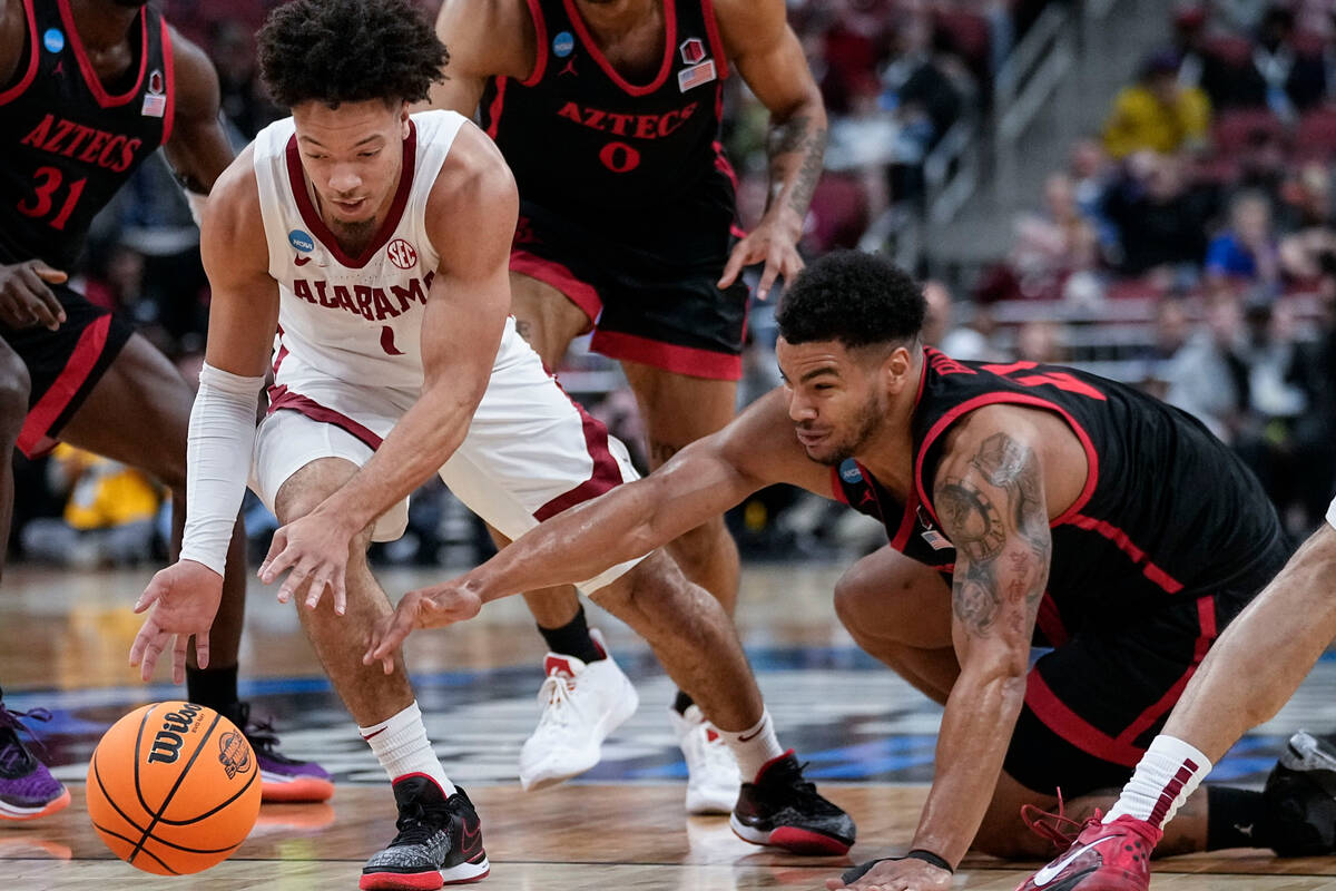 Alabama guard Mark Sears (1) and San Diego State guard Matt Bradley (20) vie for a loose ball i ...