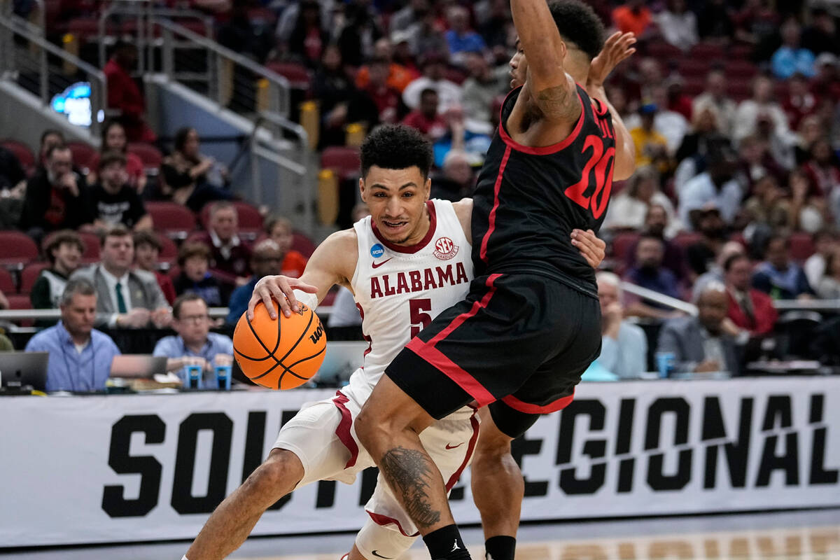 Alabama guard Jahvon Quinerly (5) moves against San Diego State guard Matt Bradley (20) in the ...