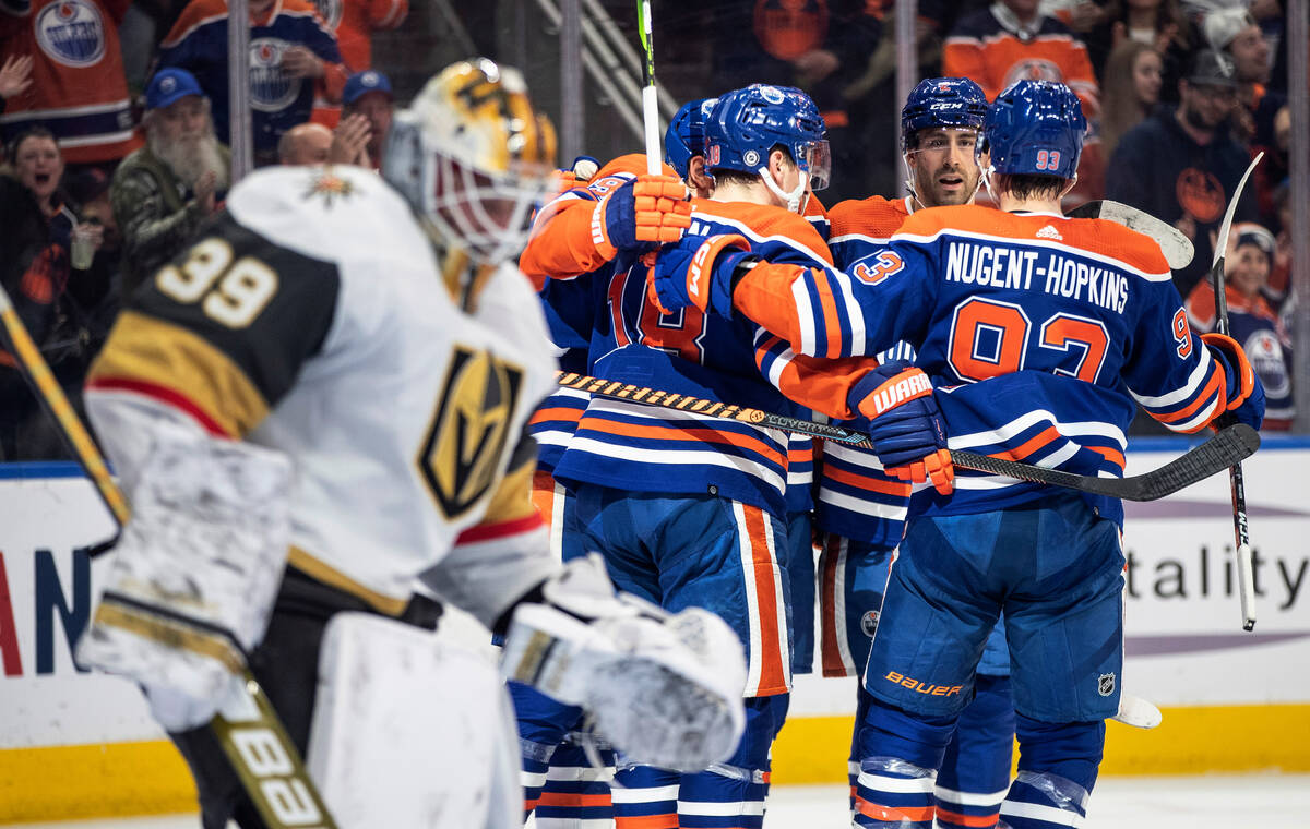 Vegas Golden Knights goalie Laurent Brossoit (39) looks away as the Edmonton Oilers celebrate a ...