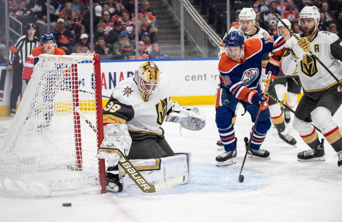 Vegas Golden Knights goalie Laurent Brossoit (39) makes a save as Edmonton Oilers' Zach Hyman ( ...